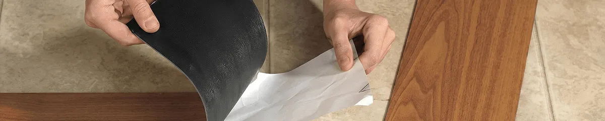 A professional installing vinyl flooring in Columbus, GA